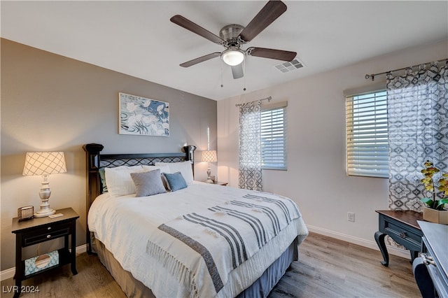 bedroom featuring ceiling fan and wood-type flooring