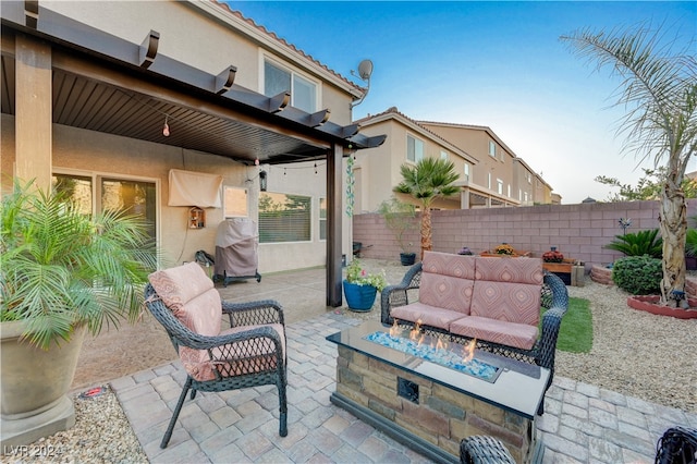 view of patio featuring a fire pit and a grill