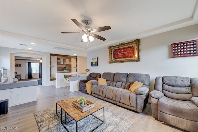 living room featuring ceiling fan and wood-type flooring