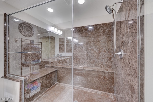 bathroom with tiled shower