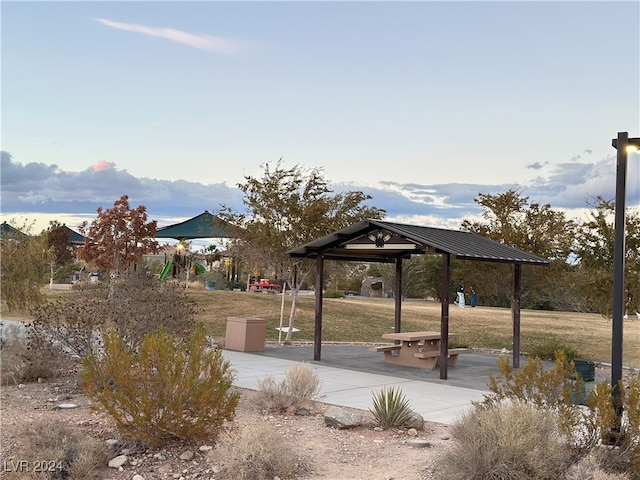 surrounding community with a gazebo and a yard