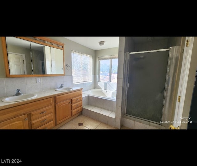 bathroom with vanity, decorative backsplash, shower with separate bathtub, and tile patterned floors