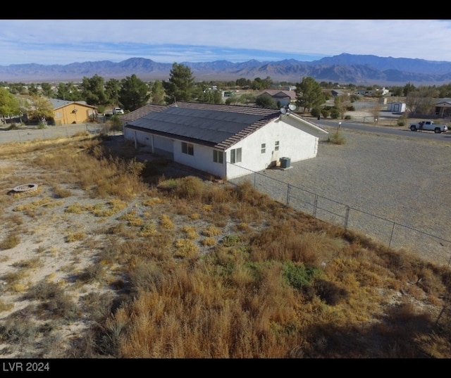 birds eye view of property with a mountain view