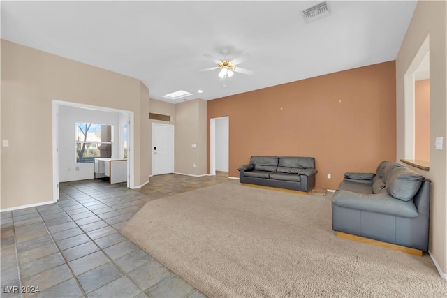 unfurnished living room featuring tile patterned floors and ceiling fan