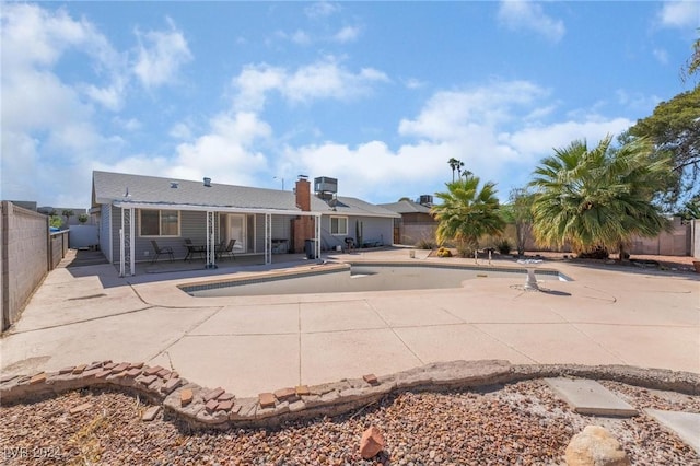 4010 E Twain Ave, Las Vegas, NV 89121 - rear view of property featuring a patio area and a chimney