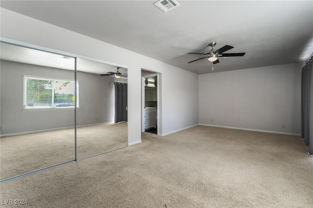 unfurnished bedroom with light carpet and ceiling fan