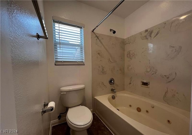 bathroom featuring bathing tub / shower combination and toilet