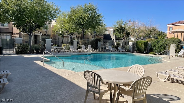 view of swimming pool featuring a patio area