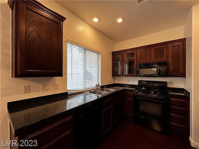 kitchen featuring dark brown cabinets, sink, and black appliances