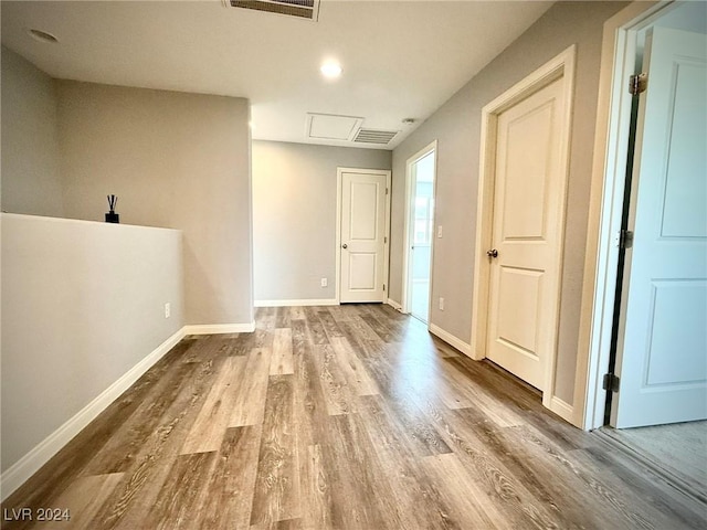 corridor featuring hardwood / wood-style flooring