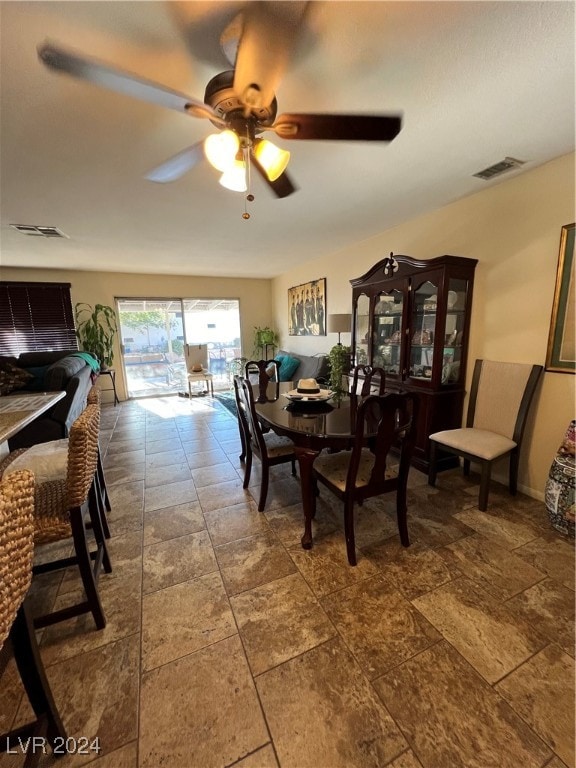 dining room featuring ceiling fan