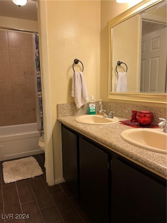 4369 Greenhill Dr, Las Vegas, NV 89121 - bathroom featuring double vanity, shower / bathtub combination with curtain, and toilet