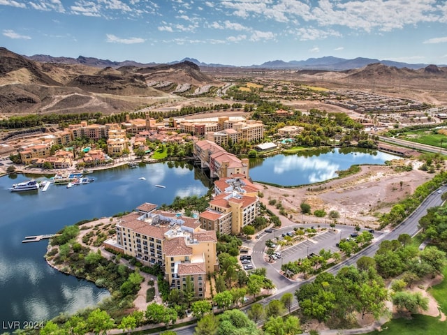 drone / aerial view with a water and mountain view