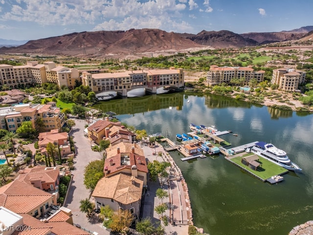 drone / aerial view featuring a water and mountain view