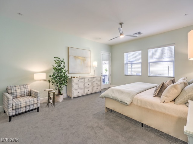 bedroom featuring ceiling fan and light colored carpet