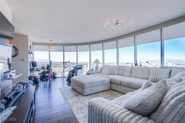 living room featuring a wall of windows and wood-type flooring