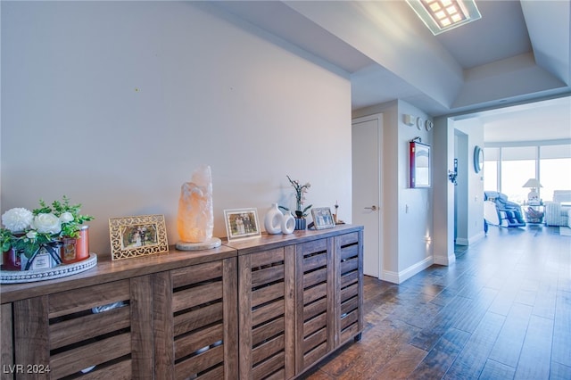 hallway with dark hardwood / wood-style floors