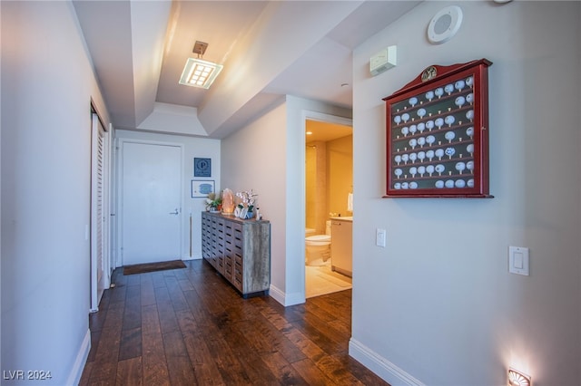 corridor with dark wood-type flooring