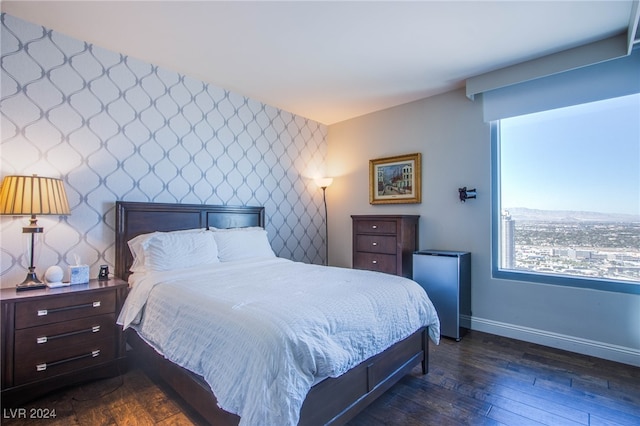 bedroom featuring dark hardwood / wood-style flooring