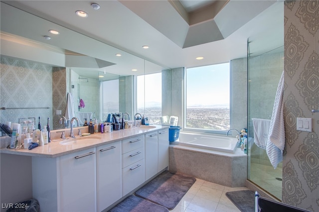 bathroom featuring vanity, independent shower and bath, and tile patterned flooring