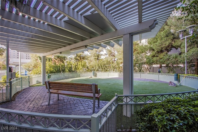 view of home's community with a pergola, a patio, and a yard