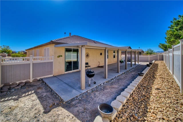 rear view of house with a patio area