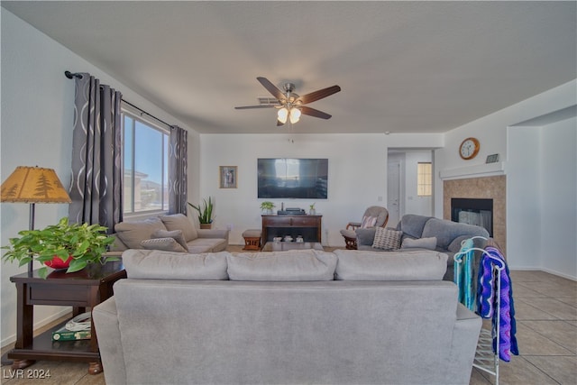 living room with ceiling fan and light tile patterned floors