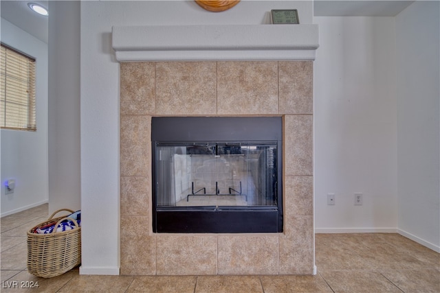 details with tile patterned floors and a tile fireplace