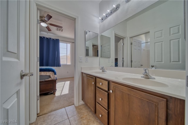 bathroom with vanity, ceiling fan, and tile patterned flooring