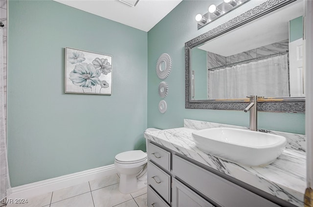 bathroom featuring vanity, a shower with curtain, toilet, and tile patterned floors