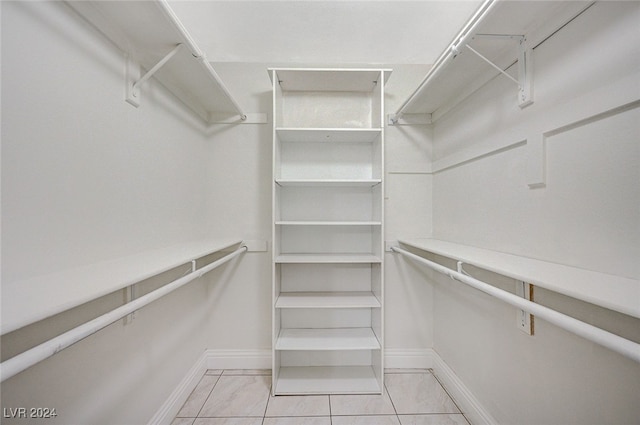 spacious closet with light tile patterned flooring