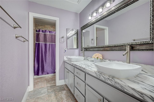 bathroom with vanity and a shower with shower curtain