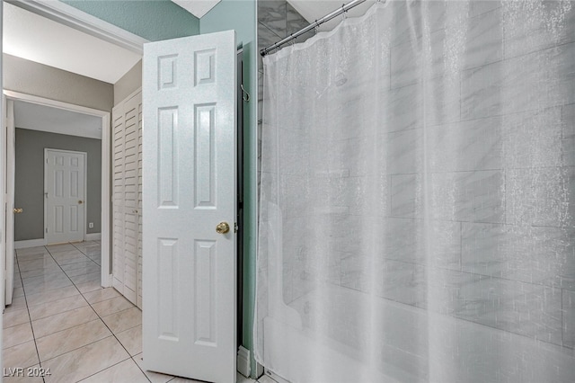 bathroom featuring tile patterned floors and a shower with curtain