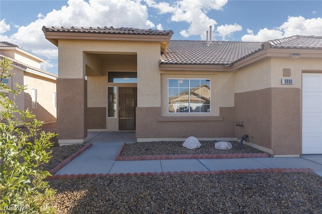 property entrance featuring a garage