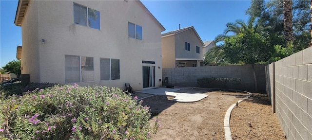 back of house featuring a patio