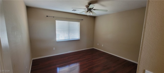 unfurnished room featuring ceiling fan and dark hardwood / wood-style floors