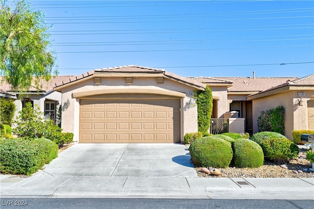 ranch-style house featuring a garage