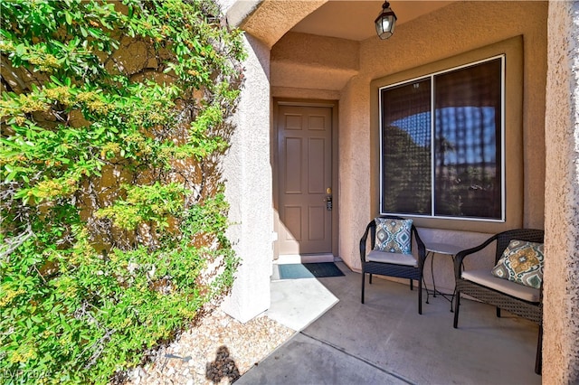 entrance to property featuring a patio area