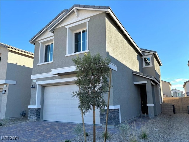 view of front of property featuring a garage