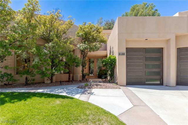 adobe home featuring a garage