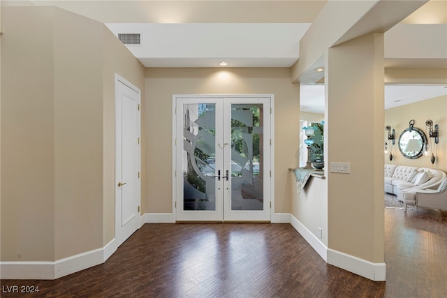 entryway with french doors and dark hardwood / wood-style flooring