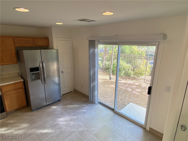 kitchen with stainless steel fridge with ice dispenser