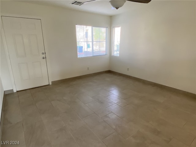 unfurnished room featuring ceiling fan