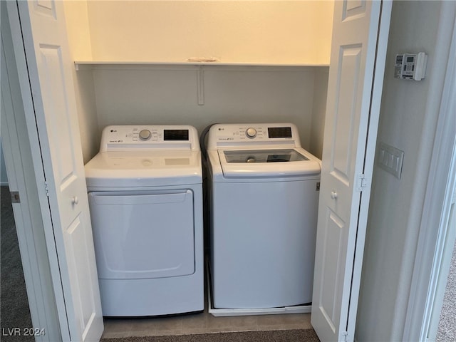 laundry room featuring independent washer and dryer and tile patterned floors