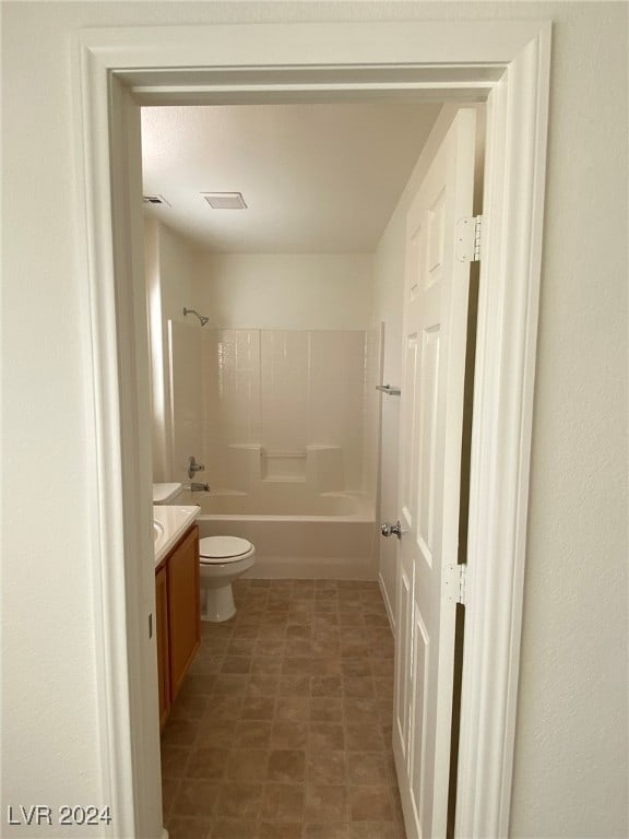 full bathroom with toilet, vanity, and shower / bath combination