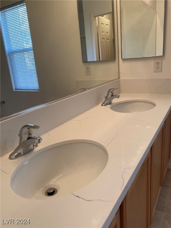 bathroom with vanity and tile patterned floors