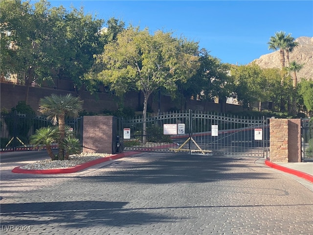 view of gate featuring a mountain view