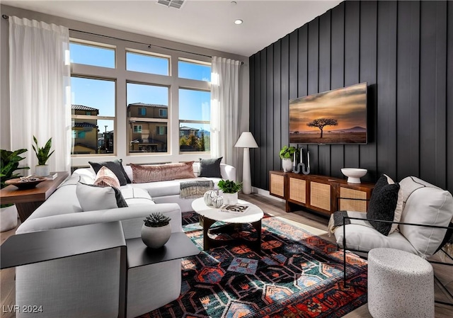 living room with plenty of natural light and hardwood / wood-style floors