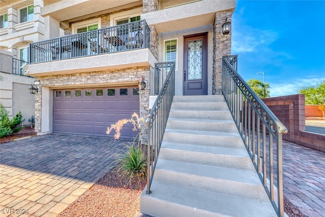 doorway to property with a garage