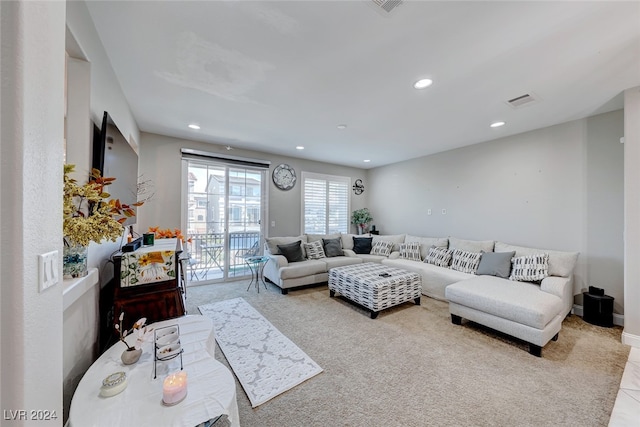 living room with light colored carpet